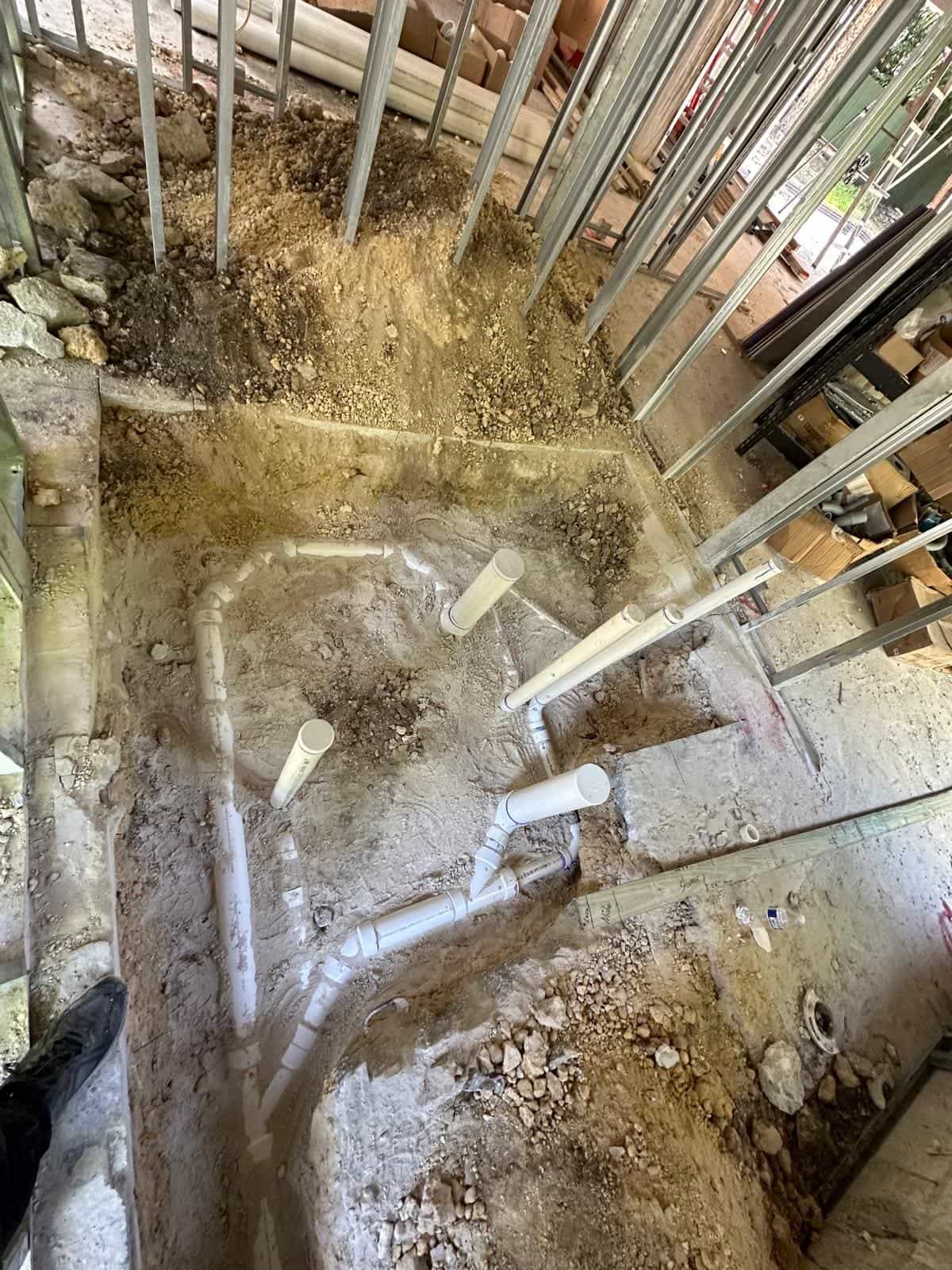 Before and after of a Underground pipe assemply by a plumber in Palmetto Bay